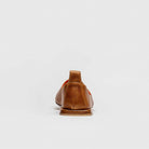 Brown leather shoe on a white background  Calfskin Black Mojri, handmade in Italy