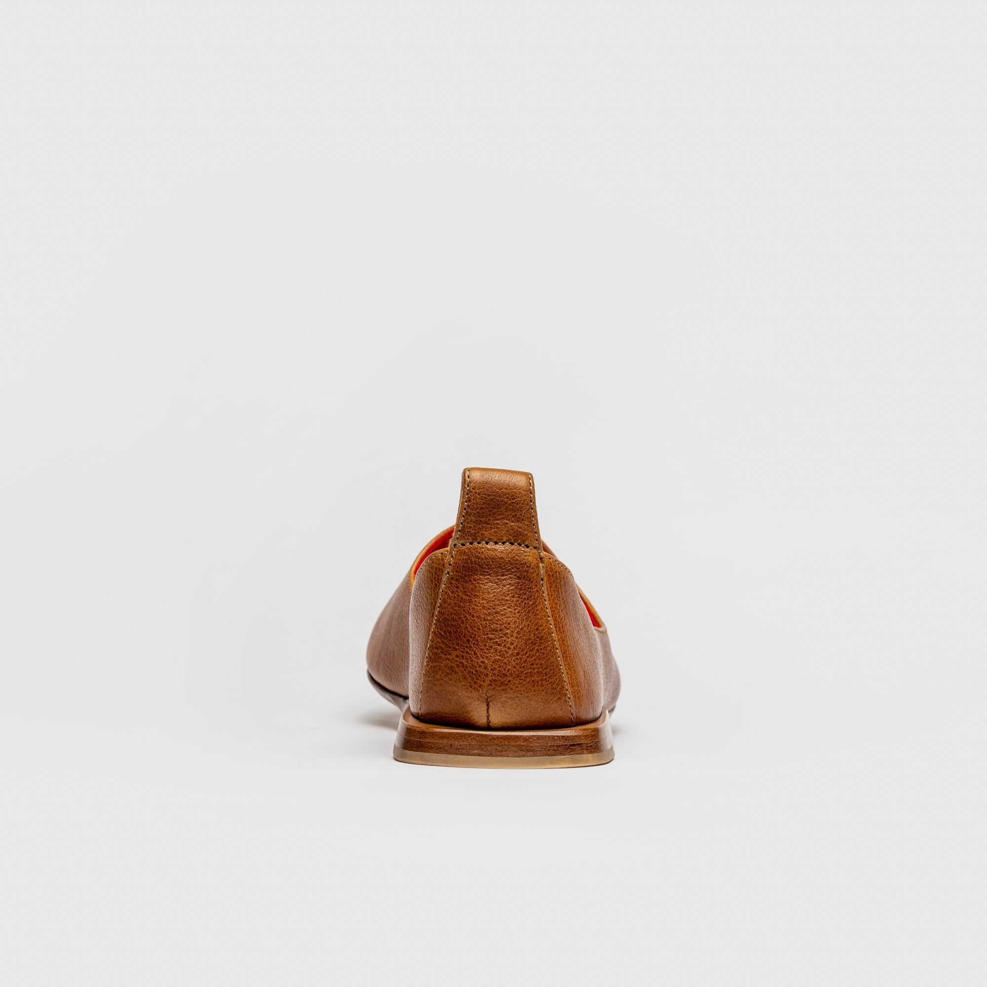 Brown leather shoe on a white background  Calfskin Black Mojri, handmade in Italy