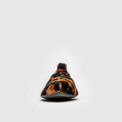 Single leopard print mojri slipper on a white background