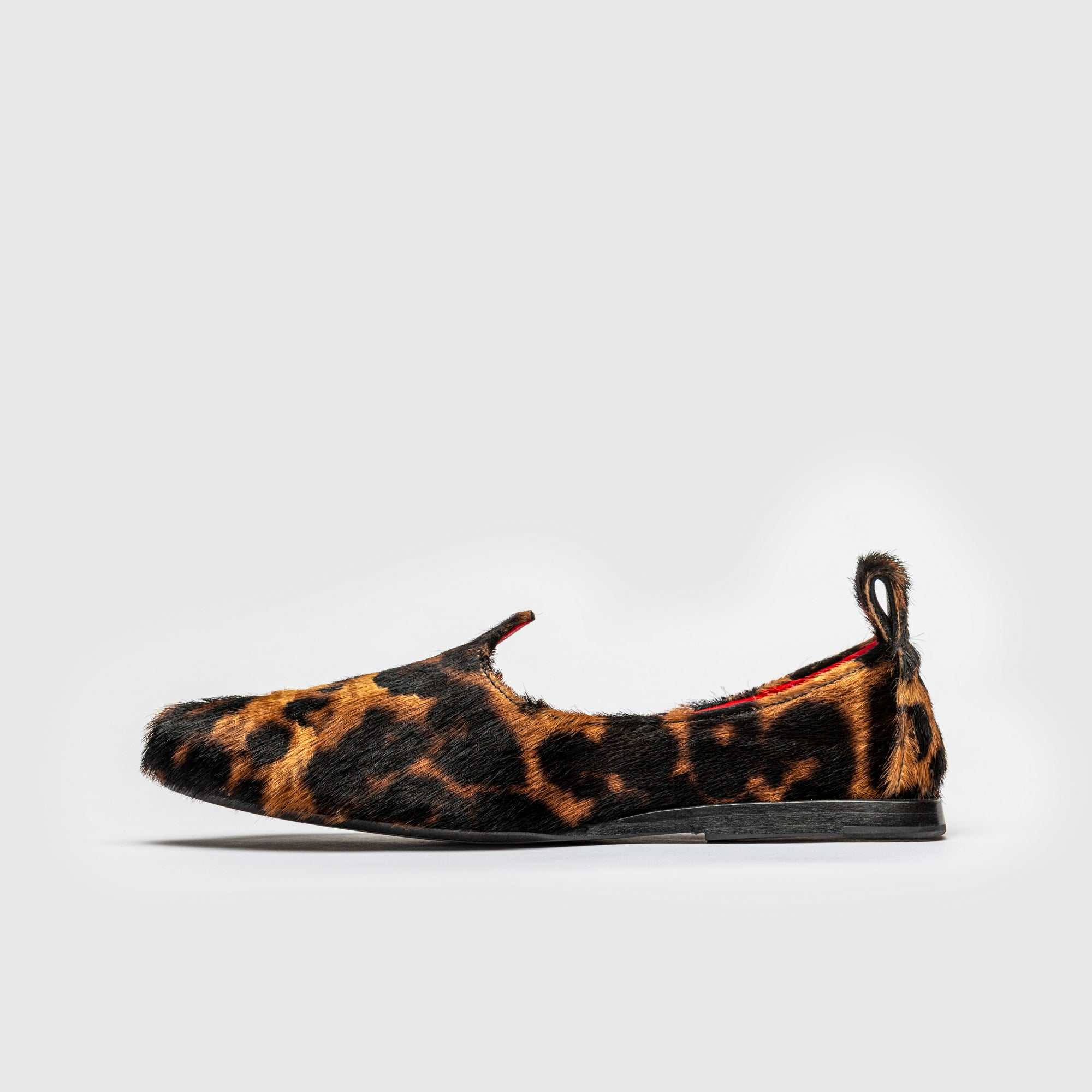 Leopard hair-on calfskin Mojri loafer, made by hand in Tuscany, with red lambskin lining.